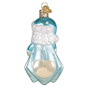 A delicate light blue glass baby boys 1st santa lovey ornament shaped like a snow-covered figure with a heart window