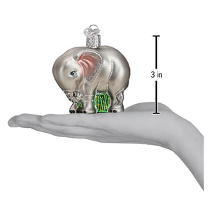 Silver glass baby elephant ornament with pink ears and green striped pants perfect as lighted figural decor