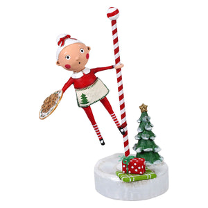 A childs christmas figure baking spirits bright elf figurine holding cookies perfect for holiday decor