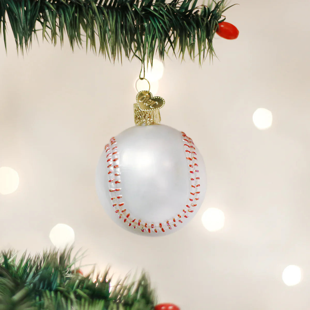 White glass baseball ornament with red stitching and gold heart tag perfect figural decor with glass and glitter accents