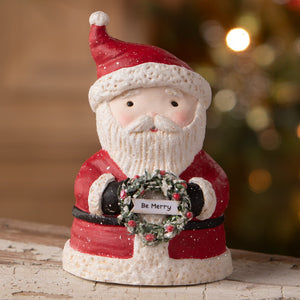 Be merry santa red and white ceramic santa figure holding snowy wreath with tag from bethany lowe designs folk art santas
