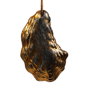 Gold and black metallic oyster shell ornament hanging from string part of beachcombers figural decor set