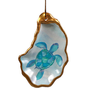 Decorative oyster shell ornament with gold trim and painted turquoise sea turtle from beachcombers set figural decor