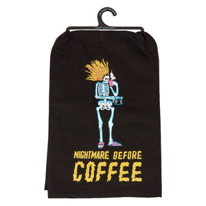 Black fabric inn kitchen towel with cartoon skeleton holding coffee cup and nightmare before coffee text in bold yellow