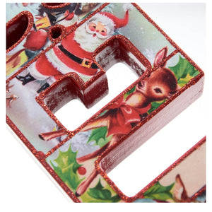 Decorative Christmas letter ’R’ with Santa Claus and reindeer imagery.