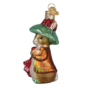 Glass Benjamin bunny ornament featuring a charming mouse in a green hat with red trim and orange coat for figural decor