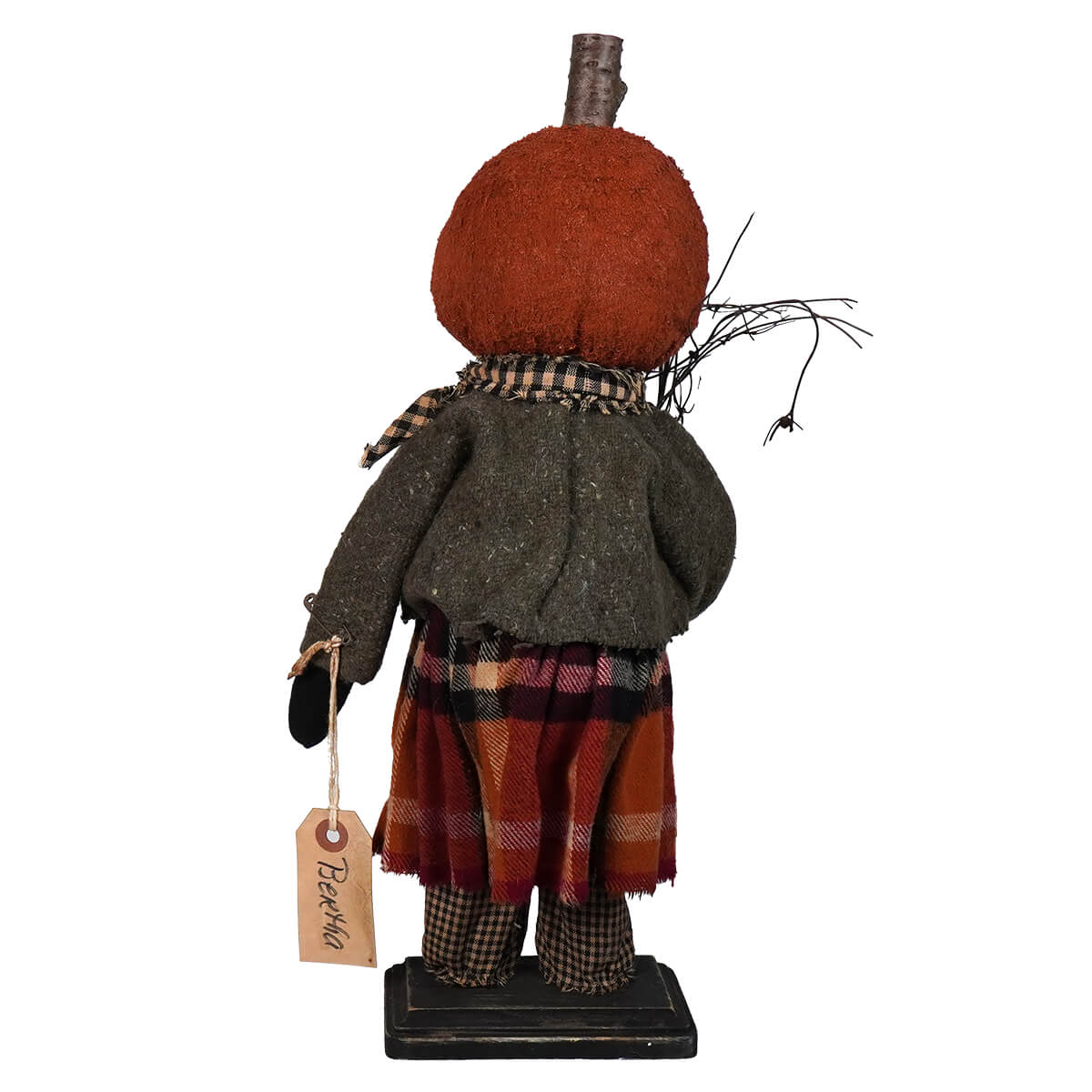 Decorative autumn-themed figurine with a pumpkin head and rustic clothing.