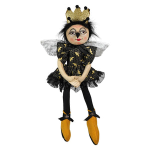 Betty bee doll by joe spencer features a black and gold bee with a glittery crown, lace dress, sheer wings, and yellow boots for spring and garden decor
