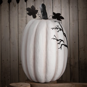 A white ribbed raven pumpkin with black glittery leaf and branch accents perfect for halloween pumpkins and gourds displays