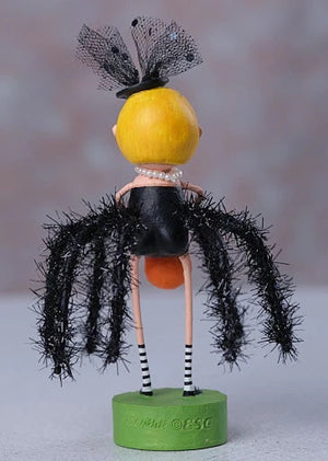 A lori mitchell halloween black widow figurine with a lace hat, sparkly spider legs, and striped socks in black and yellow