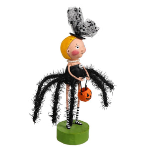 A lori mitchell halloween black widow figurine of a blonde girl in a black dress and lace hat on a green base