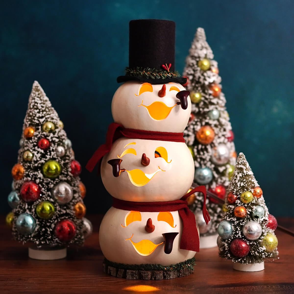 Blake lighted medium tall snowman gourd with three tiers glowing orange faces black top hat red scarf by meadowbrooke gourds