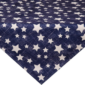 Navy blue fabric with white star pattern arranged in a triangular fold.