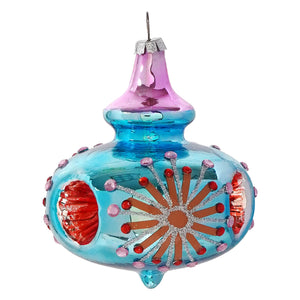 A vibrant blue glass reflector kismet ornament with pink top and red silver glittery starburst jeweled design