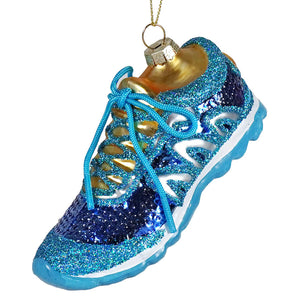 A sparkling blue running shoe ornament with gold glitter and metallic finish perfect for holiday decoration