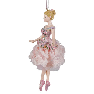A delicate blush pink blonde ballerina ornament with floral details and a sheer ruffled skirt hanging by a white string