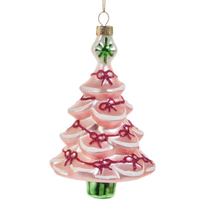 A pink glass tree ornament from raz imports christmas with glittery red bows white trim and a green star top