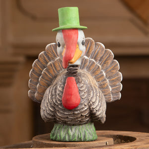A charming bethany lowe ceramic bobble head turkey with green top hat and detailed brown feathers thanksgiving turkeys