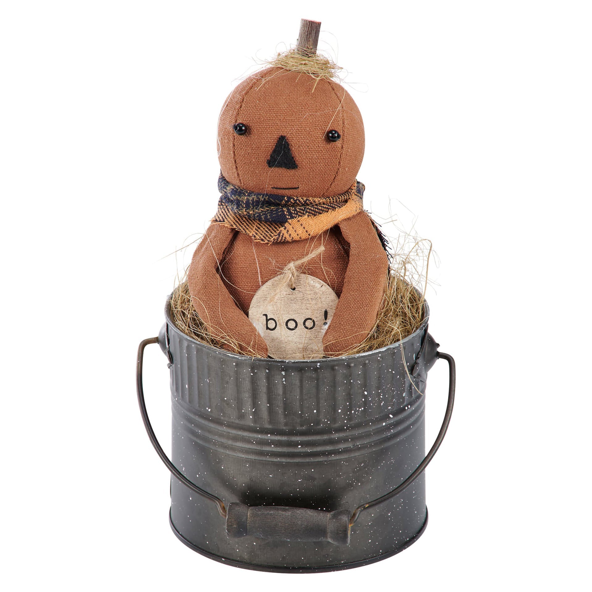 Brown fabric boo doll pumpkin with black embroidered face and plaid scarf nestled in hay in a metal bucket halloween dolls