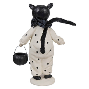 Black and white polka dotted cat figurine boo boo by dee harvey dressed in halloween costume holding black pumpkin bucket