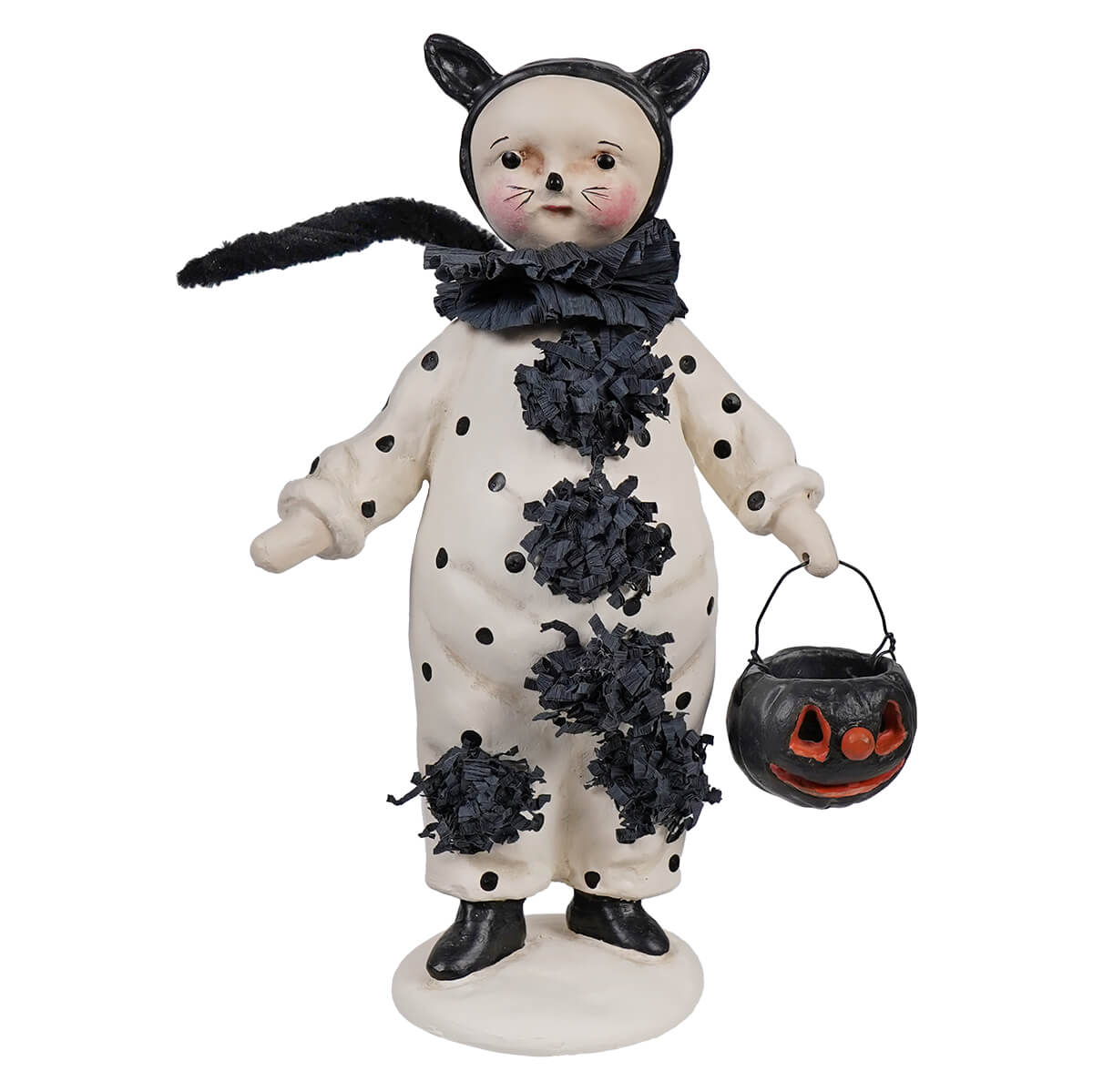 A whimsical black and white polka-dotted cat halloween figurine with fringed accents holding a jack o lantern bucket boo boo by dee harvey