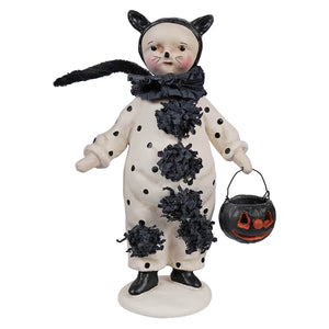 A whimsical black and white polka-dotted cat halloween figurine with fringed accents holding a jack o lantern bucket boo boo by dee harvey