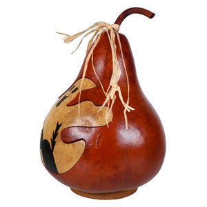 Hand-painted traditional jack gourd with ghost and black cat design tied with twine from meadowbrooke gourds for halloween pumpkins and gourds decor