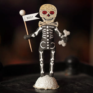 Boo skeleton figure with beige skull red eyes white bones on black body holding boo flag for halloween decor