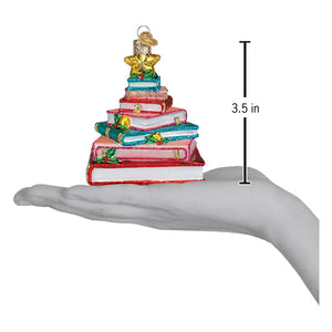 Colorful glittery glass book club tree ornament shaped like stacked books with gold and green library ornament accents