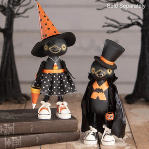 Two black wooden bethany lowe halloween figures featuring boris crowloff pumpkin sitter with witch and bat costumes