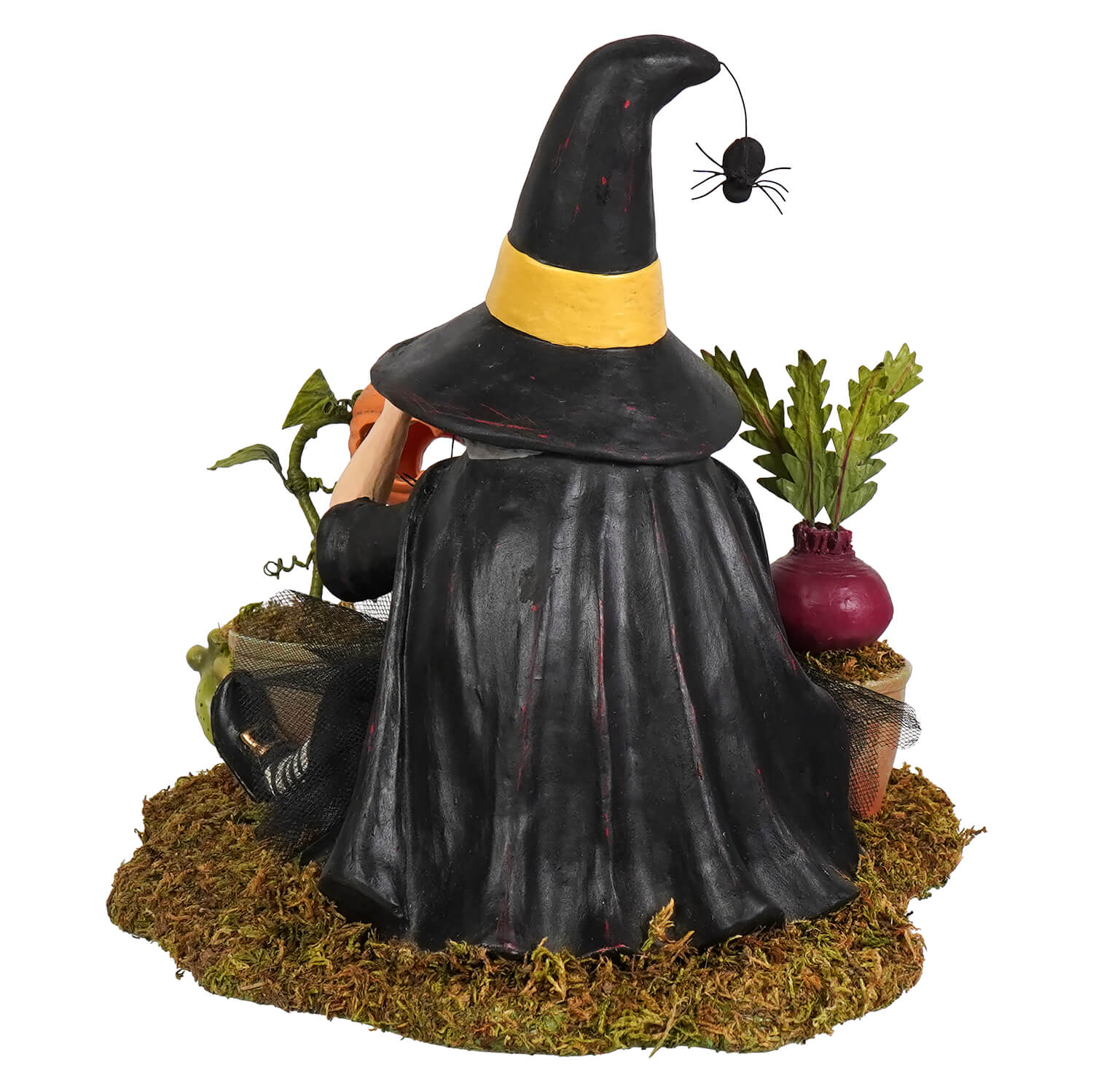 Botany witch black witch figurine with yellow hat band and spider seated on mossy base with miniature plants perfect for halloween witches