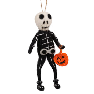 Black felt skeleton felt ornament with white stitches holding an orange glittery pumpkin basket non-glass ornaments