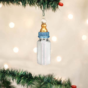 Delicate glass boy baby bottle ornament with gold cap, blue ribbed ring, frosted white body, and sparkling glitter