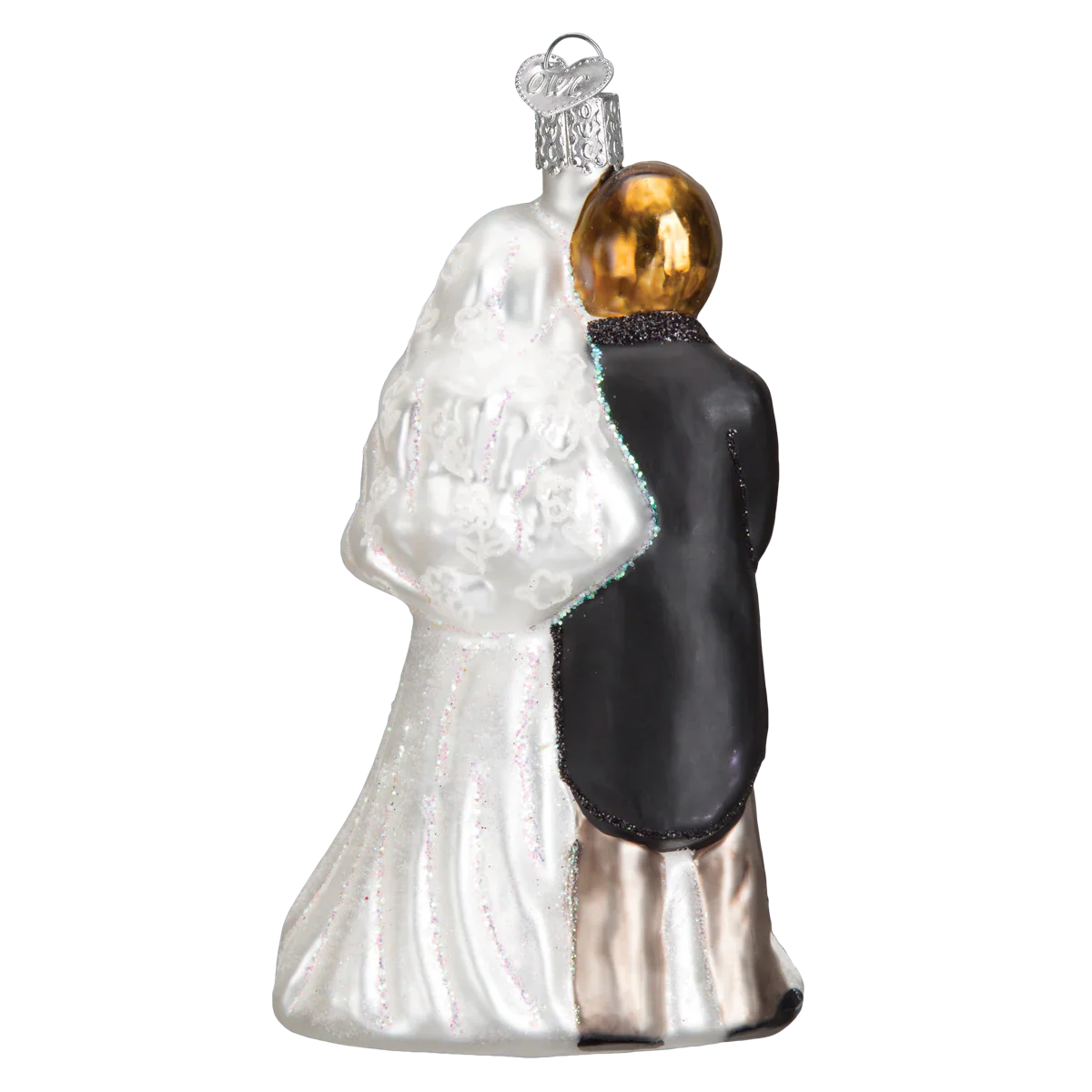A glass bridal couple ornament featuring a bride in white gown and groom in black suit with gold heads perfect as tree toppers or lighted decor