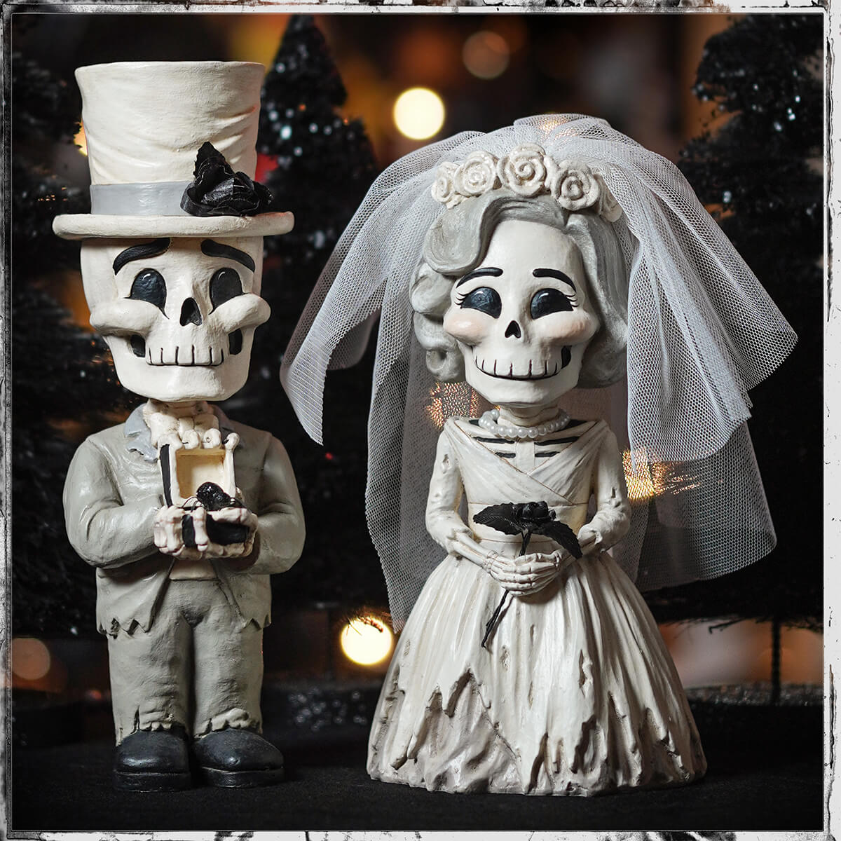 White skeleton bride and groom figurines in wedding attire with groom skelly holding ring box bethany lowe groom skelly bundle