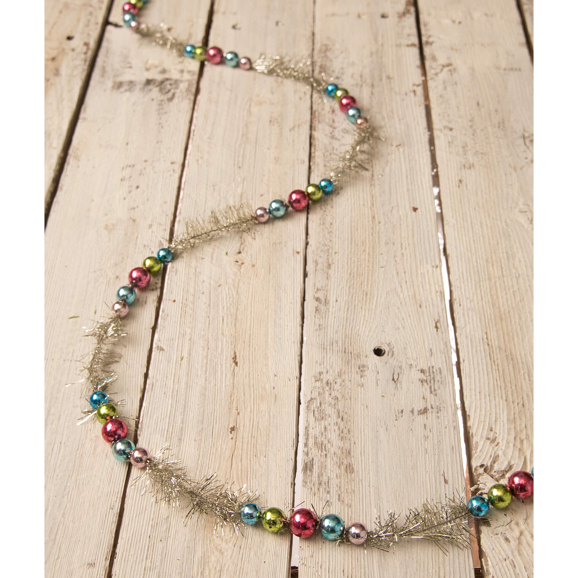 Bright bead garland by bethany lowe featuring shiny multicolored glass beads on a silver tinsel base for festive decor