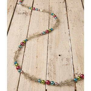 Bright bead garland by bethany lowe featuring shiny multicolored glass beads on a silver tinsel base for festive decor