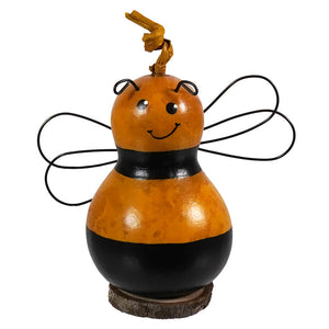 Tiny hand-crafted gourd bumble bee ornament with hand-painted orange black body and wire wings by meadowbrooke gourds artisans