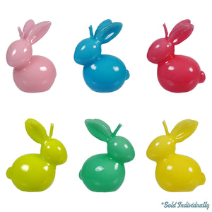 Six colorful ceramic or plastic bunny figurines arranged in two rows.