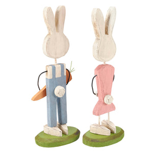 Two wooden easter bunny couple stand-up figurines with white heads green bases bunny wearing blue overalls and pink dress