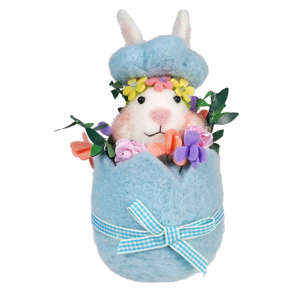 Plush Easter bunny in a blue egg-shaped holder decorated with flowers and a gingham bow.