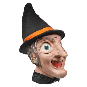 A vintage-style cackling witch lantern with a black hat orange band and textured aged plaster skin from honest heirloom decor