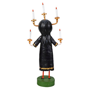 Black candle maker figurine with gold-trimmed arms holding six white candles on golden holders lori mitchell halloween figures