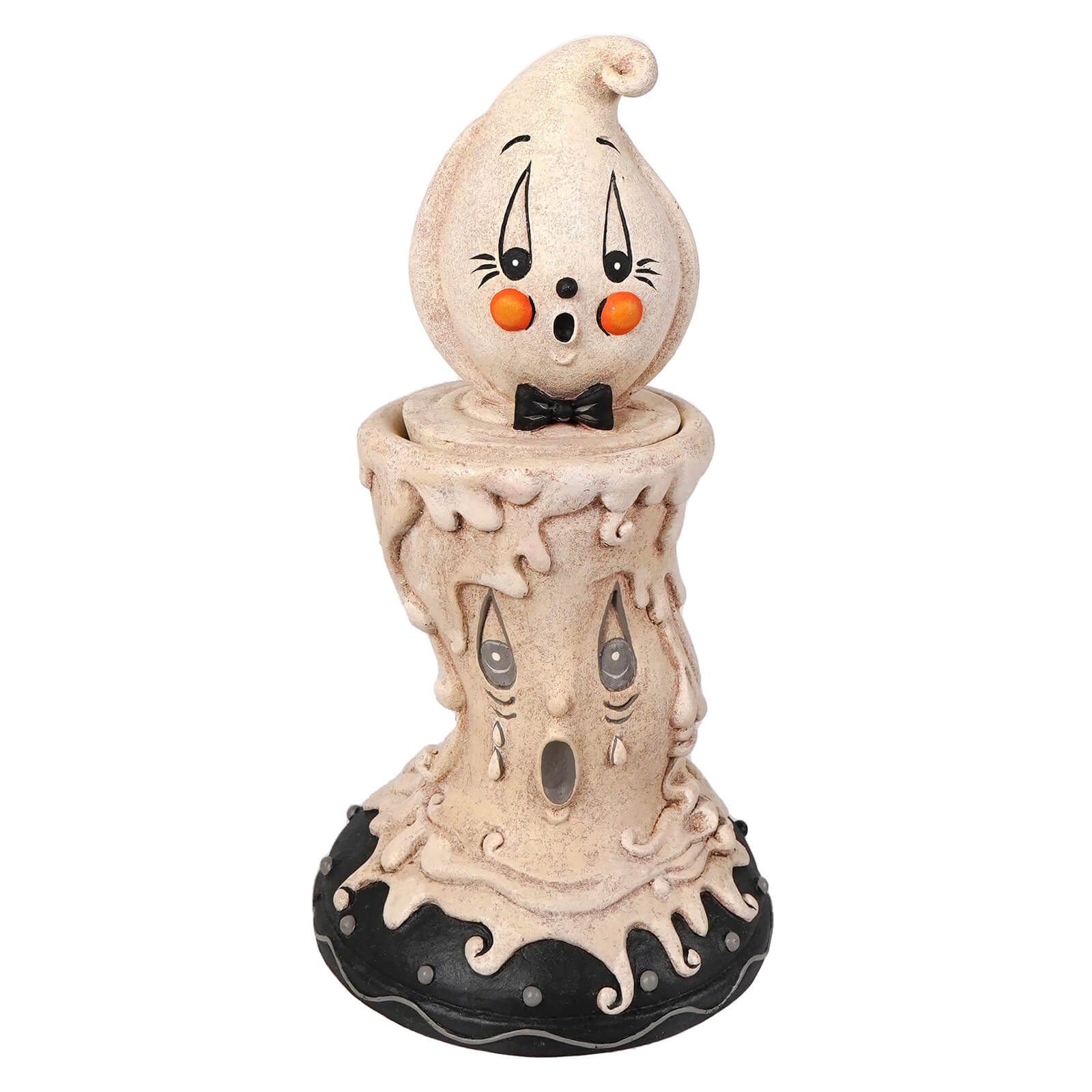 A whimsical beige ghost candlestick with orange cheeks and black bow tie on a melting base with glowing eyes perfect for johanna parker halloween decor