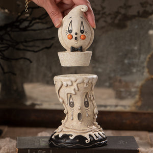 Whimsical cream ceramic candlestick gus with playful ghost face orange cheeks and black bow tie johanna parker halloween decor