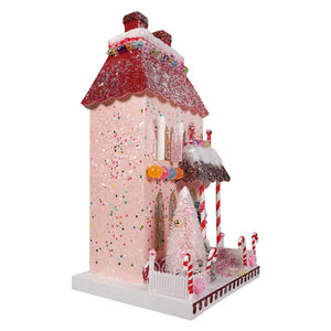 A whimsical pink candy cane manor house with a glittery red roof and colorful sprinkles by cody foster