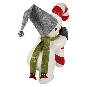 A festive white christmas snowman figure wearing a silver jester hat and green scarf holding a candy cane decor piece