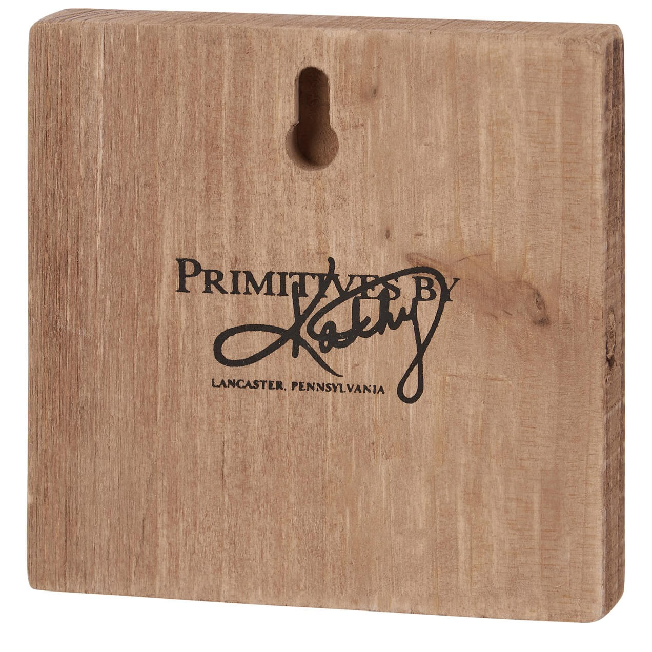 Wooden block with ’Primitives by Kathy’ branding from Lancaster, Pennsylvania.