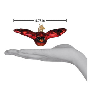 Glossy red glass miniature cardinal ornament with black eyes and gold hook perfect for figural decor and gifts
