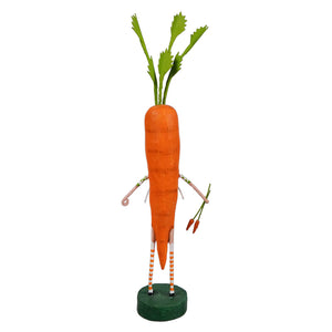 Whimsical carrot figure with striped legs standing on a green base.